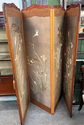 Lot 1333 - A Japanese early 20th century silk work four fold modesty screen, decorated with birds and flowers