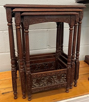 Lot 1336 - A nest of three Indian carved hardwood tables, largest 51cm by 32cm by 62cm high