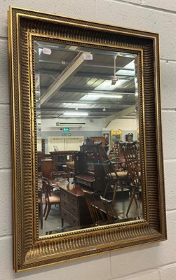 Lot 1338 - A reproduction gilt framed bevel glass mirror, 61cm by 87cm high