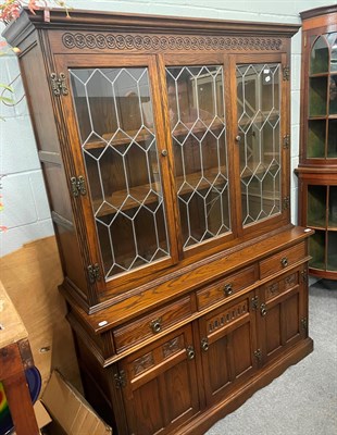 Lot 1344 - An old charm oak and lead glazed display cabinet, 134cm by 46cm by 189cm together with a...