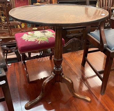 Lot 1363 - A George III mahogany dish-topped tripod table, 63cm by 75cm high