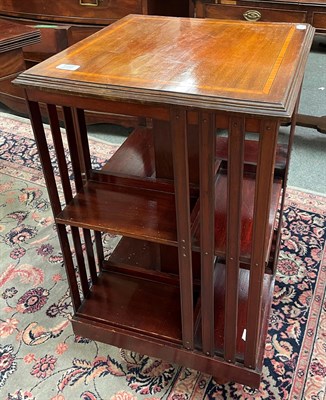 Lot 1390 - A mid 20th century mahogany revolving bookcase, 47cm square by 83cm