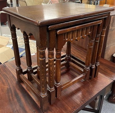 Lot 1397 - A Wood Brothers nest of tables of rectangular graduated form, raised on turned legs with block...
