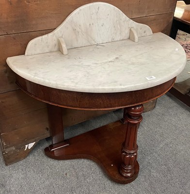 Lot 1398 - A Victorian mahogany demi-lune marble topped washstand, 90cm by 47cm by 91cm