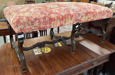 Lot 1400 - A mahogany framed long stool with overstuffed seat, double scrolling supports and undulating...