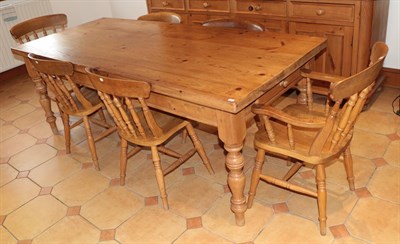 Lot 1405 - A reclaimed pine kitchen table with rectangular top and single-drawer, 214cm by 90cm by 79cm, and a