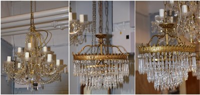 Lot 1435 - A twelve branch chandelier with lustre drops, 55cm drop, together with a pair of gilt metal...