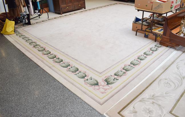 Lot 1228 - A large cream ground carpet with floral border, by Signature Carpets, Hebden Bridge, 6.3m by 4.76m