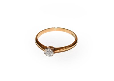 Lot 140 - A diamond solitaire ring, the old cut diamond in a white millegrain setting to a yellow tapered...