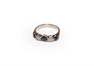 Lot 146 - A sapphire and diamond five stone ring, three round cut sapphires alternate with round cut...