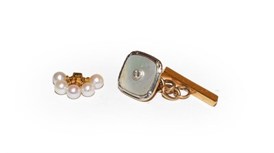 Lot 147 - A single diamond and mother-of-pearl cufflink and a cultured pearl mount