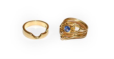 Lot 161 - An 18 carat gold sapphire ring, finger size M1/2 and an 18 carat gold interlocking band ring,...