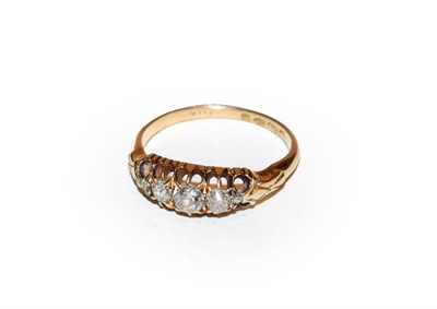 Lot 166 - An 18 carat gold diamond five stone ring, the old cut diamonds in yellow claw settings, to a...