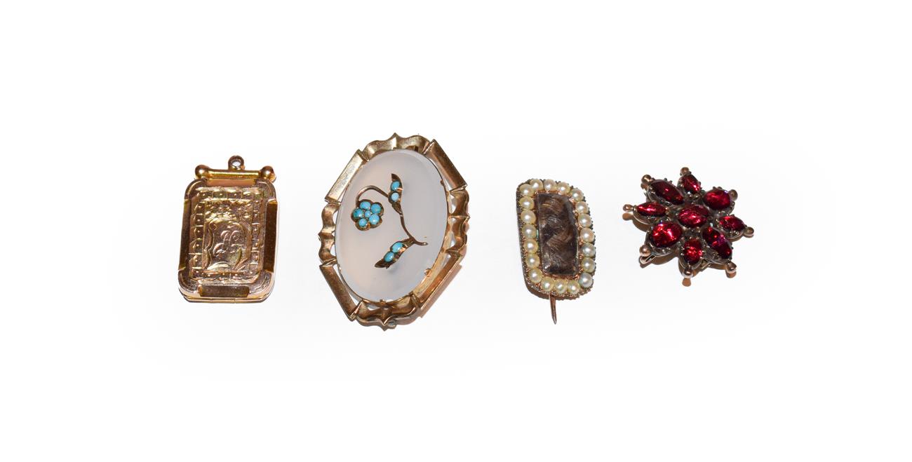 Lot 179 - A mourning brooch, length 2.1cm, a locket stamped '9CT BACK & FRONT' and two further brooches