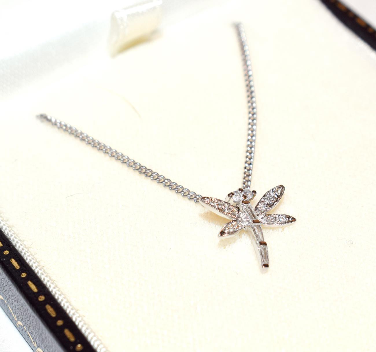 Lot 181 - A diamond dragonfly pendant on chain, the dragonfly set throughout with baguette cut and round...