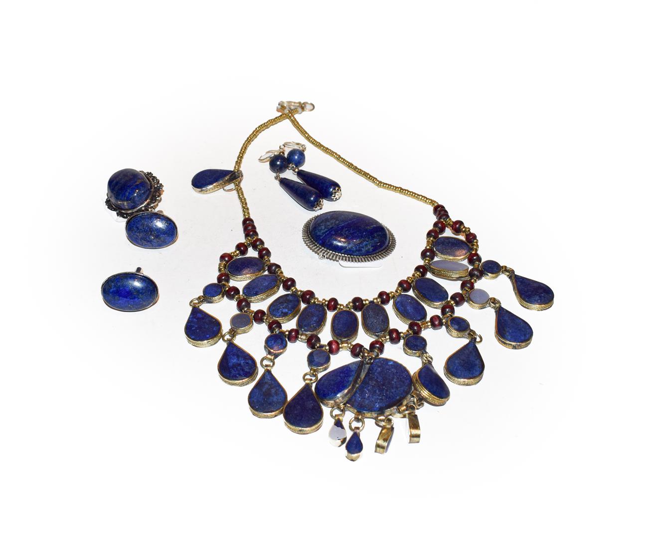 Lot 191 - A group of lapis lazuli type jewellery including a cabochon brooch together with a pair of drop...