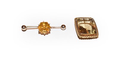 Lot 203 - A citrine pendant, length 2.5cm and a citrine brooch, length 4.3cm