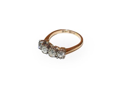 Lot 207 - A diamond four stone ring, the old cut diamonds in white claw settings, to a yellow tapered...