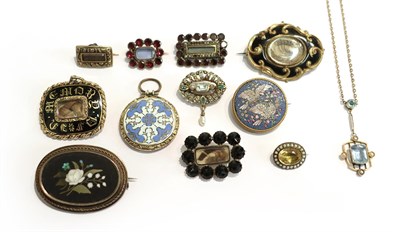 Lot 225 - A collection of jewellery including two Victorian memorial brooches, five slide brooches, circa...