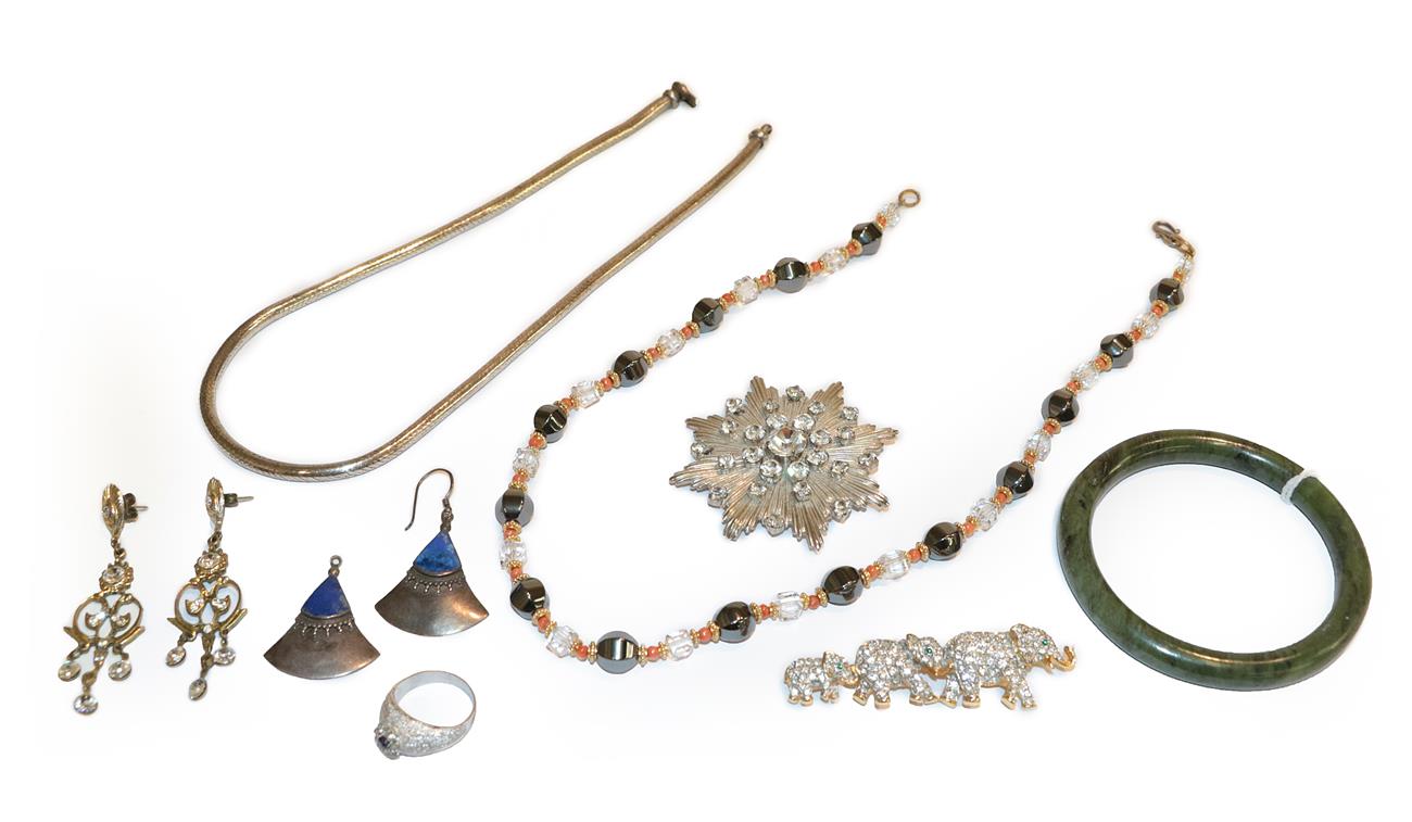 Lot 242 - A small quantity of costume jewellery including a Butler & Wilson elephant brooch, length...