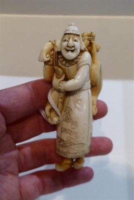 Lot 251 - Two Japanese netsukes, one a sage of a child, a netsuke of a man with a gourd and a further...