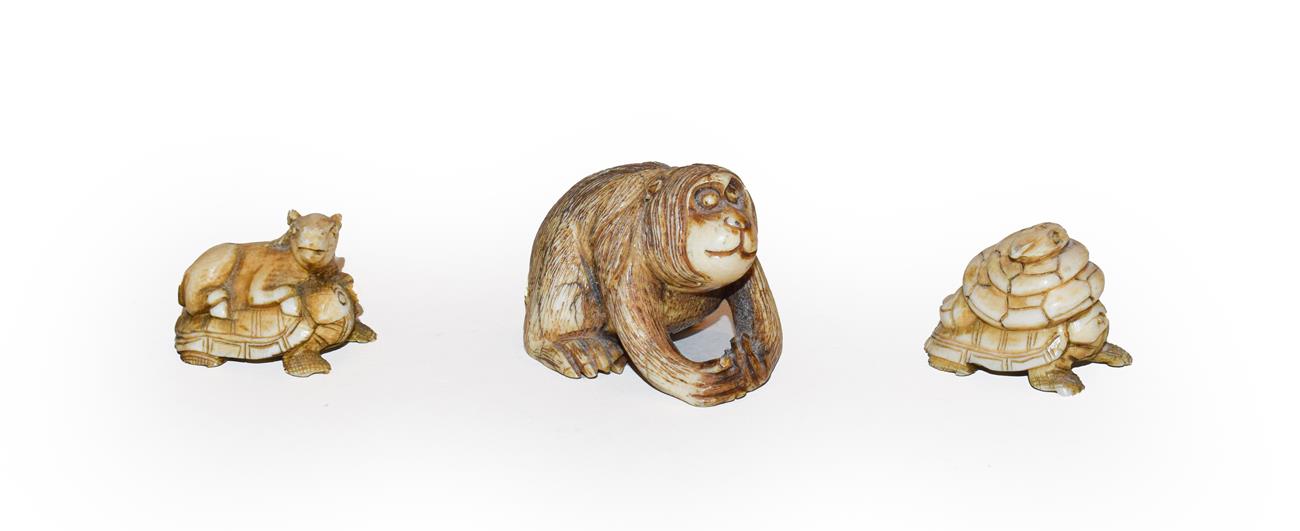 Lot 262 - A Japanese Meji period netsuke as an orangutan, signed, a netsuke of a snake on a turtles back...