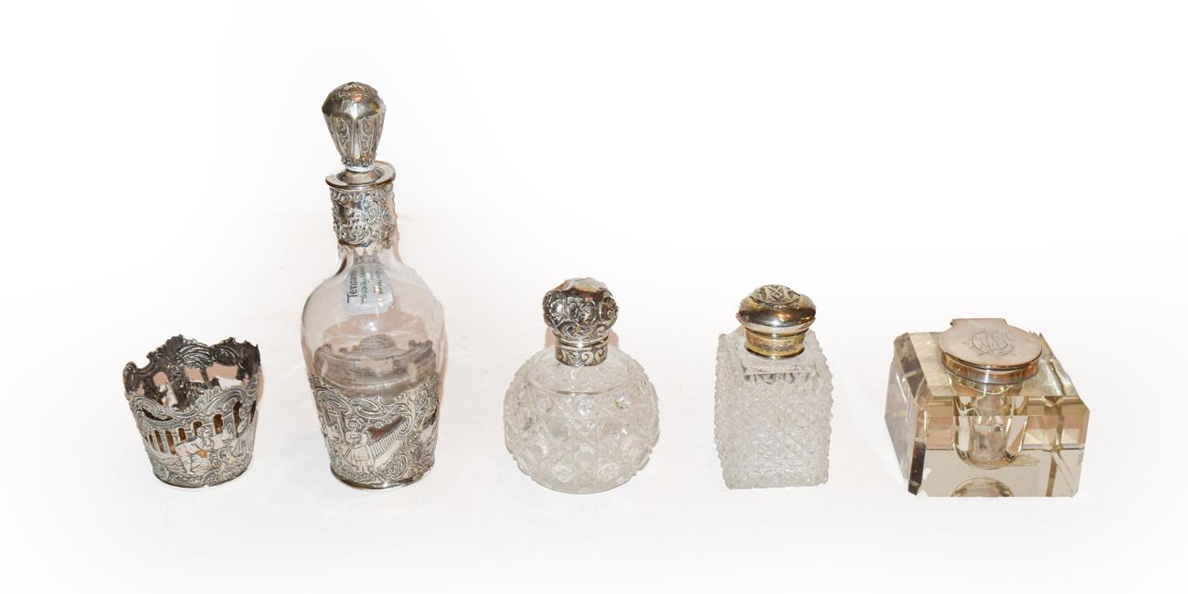 Lot 270 - Four silver mounted glass items, comprising a decanter with silver base, with English import marks