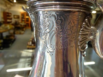 Lot 286 - A George III silver hot water jug, by John Parker and Edward Wakelin,  London, 1761, the handle and