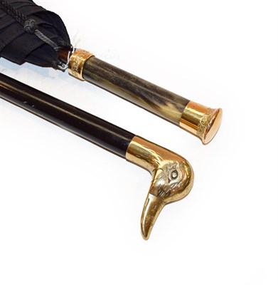 Lot 308 - An early 20th century gilt metal mounted horn handling umbrella together with an ebonised...