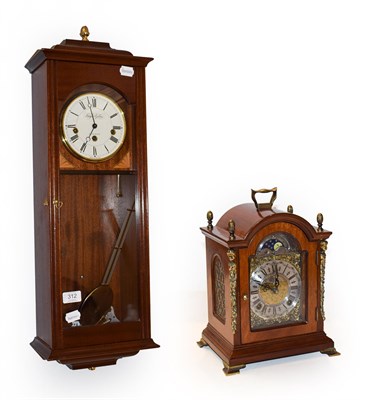 Lot 312 - A modern table clock and a wall clock (2)