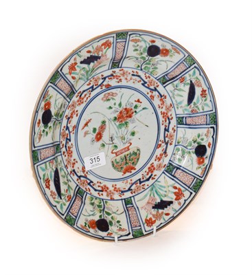 Lot 315 - An Arita Porcelain Dish, circa 1700, painted in colours in Kraak style with a central jardiniere of