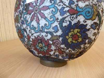 Lot 335 - A 19th century Chinese cloisonne moon flask, twin handled and decorated with stylized flowers...