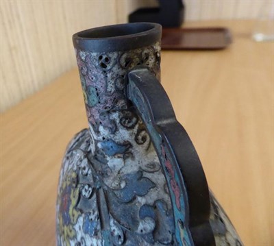 Lot 335 - A 19th century Chinese cloisonne moon flask, twin handled and decorated with stylized flowers...