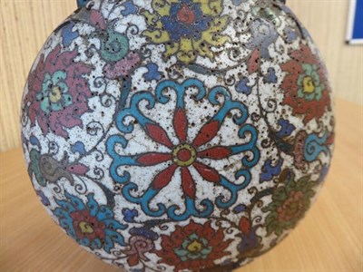 Lot 335 - A 19th century Chinese cloisonne moon flask, twin handled and decorated with stylized flowers...