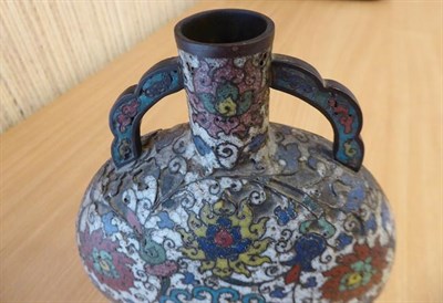 Lot 335 - A 19th century Chinese cloisonne moon flask, twin handled and decorated with stylized flowers...