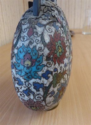 Lot 335 - A 19th century Chinese cloisonne moon flask, twin handled and decorated with stylized flowers...