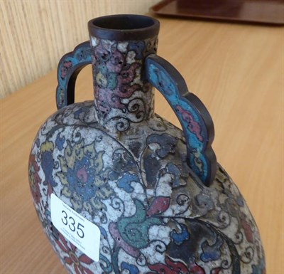 Lot 335 - A 19th century Chinese cloisonne moon flask, twin handled and decorated with stylized flowers...