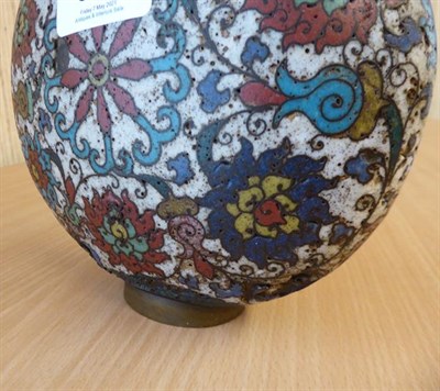 Lot 335 - A 19th century Chinese cloisonne moon flask, twin handled and decorated with stylized flowers...