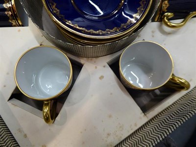 Lot 372 - Two box sets of gilt highlighted coffee cans and saucers, a moulded glass fish stand, two cut glass