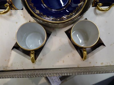 Lot 372 - Two box sets of gilt highlighted coffee cans and saucers, a moulded glass fish stand, two cut glass