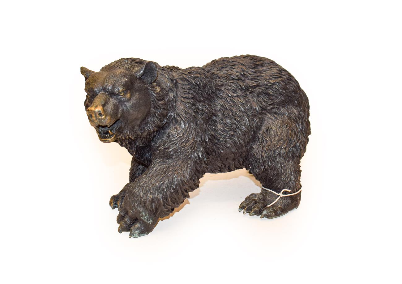 Lot 376 - A bronzed model of a grizzly bear in walking pose