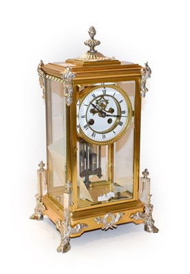 Lot 386 - A brass four glass striking mantel clock, circa 1900, brass case with silvered mounts, four...