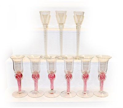 Lot 414 - A set of four air twist cordial glasses together with a set of six 20th century coloured twist...