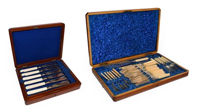 Lot 426 - A Victorian mahogany canteen of ivory handled silver plated cutlery comprising, a pair of fish...