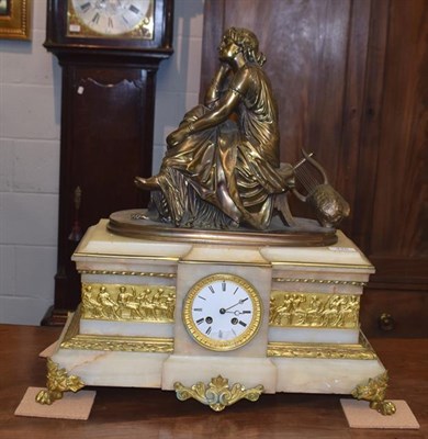 Lot 445 - An Onyx and gilt bronze striking mantel clock, circa 1870, surmounted by a gilt bronze figure...