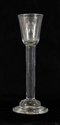 Lot 8 - A Cordial Glass, circa 1750, the rounded funnel bowl on a tall plain stem and domed foot,...