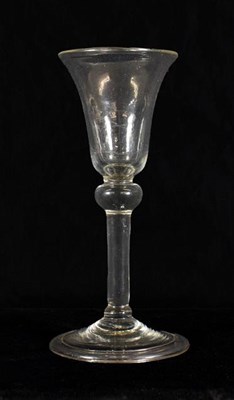Lot 9 - A Wine Glass, circa 1740, the bell shaped bowl over a ball knop and plain stem on folded foot,...