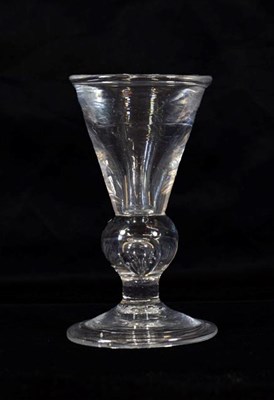 Lot 13 - A Heavy Baluster Toastmaster's Glass, circa 1720, the illusion funnel bowl on a heavy teared...
