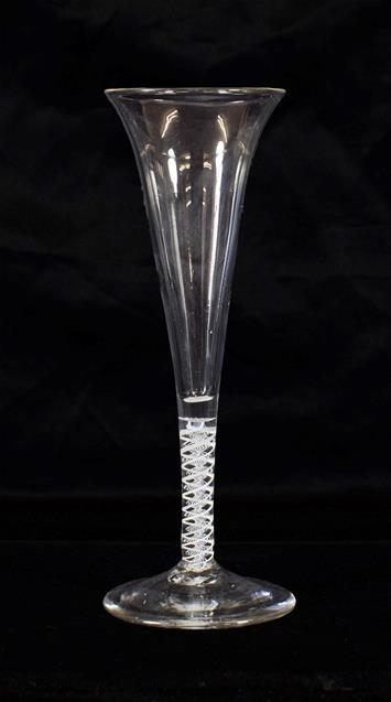 Lot 14 - A Wine Flute, circa 1770, the slender funnel with slightly everted rim on an opaque twist stem,...