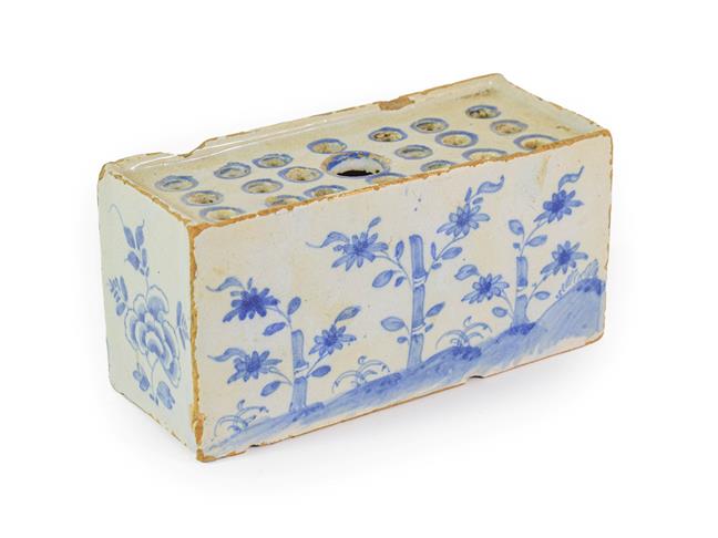 Lot 21 - An English Delft Flower Brick, circa 1750, of rectangular form, painted in blue with bamboo and...